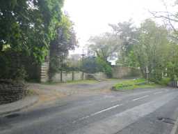 View of road leading past Tanfield Hall with walls visible May 2016
